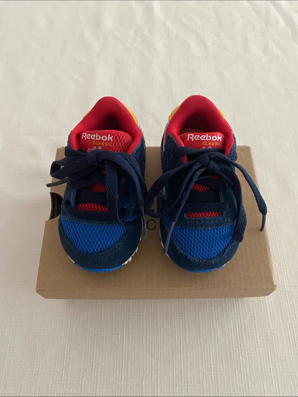 Reebok CL Leather Color Block Sneakers for babies.